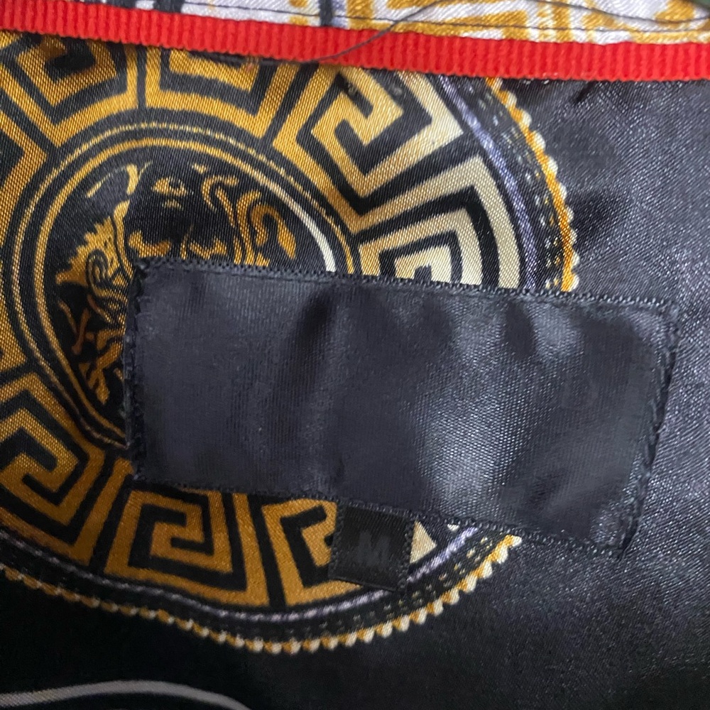 Versace Black and Gold Medusa Pattern